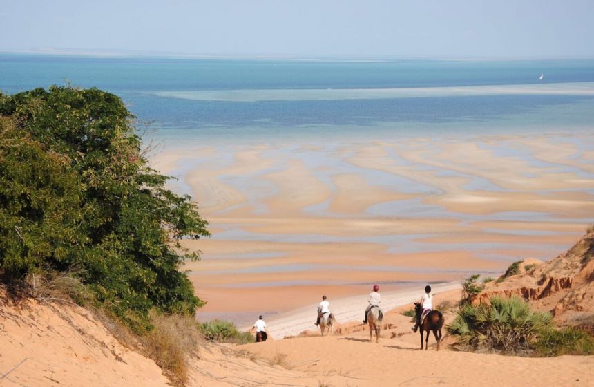 Riding horses down the beach, Mozambique